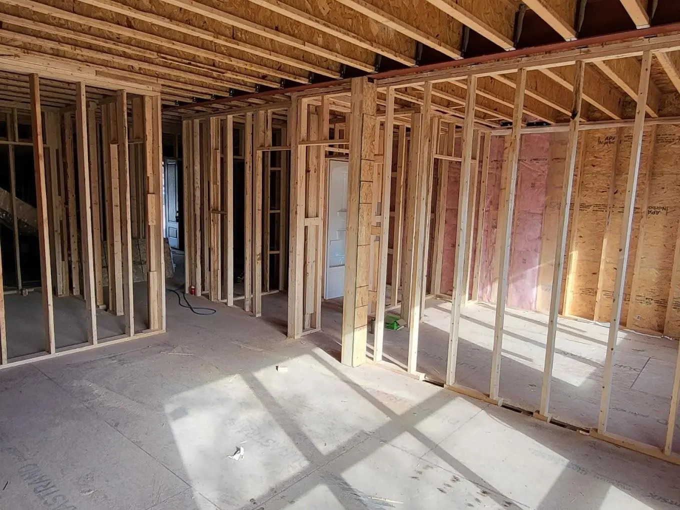 Open wood framing inside a new house before insulation and drywall
